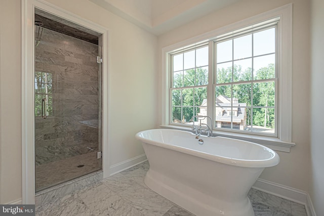 bathroom with plus walk in shower and a wealth of natural light