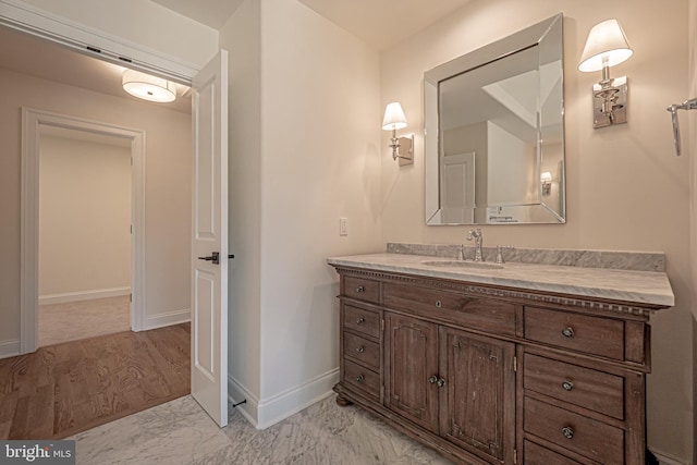 bathroom with vanity and wood-type flooring