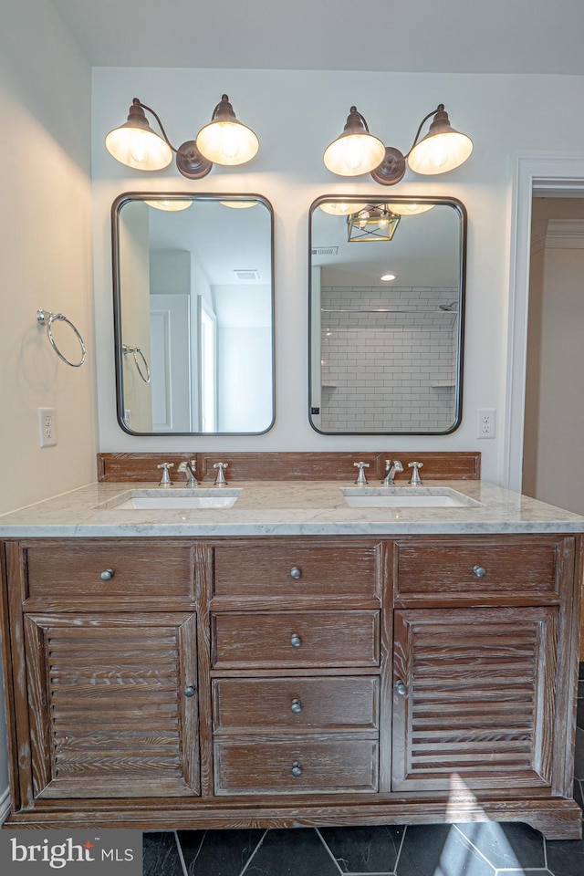 bathroom with tile patterned floors and vanity