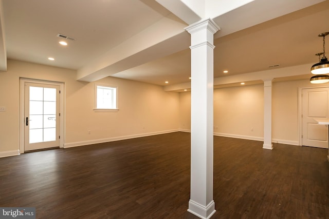 basement with dark hardwood / wood-style flooring