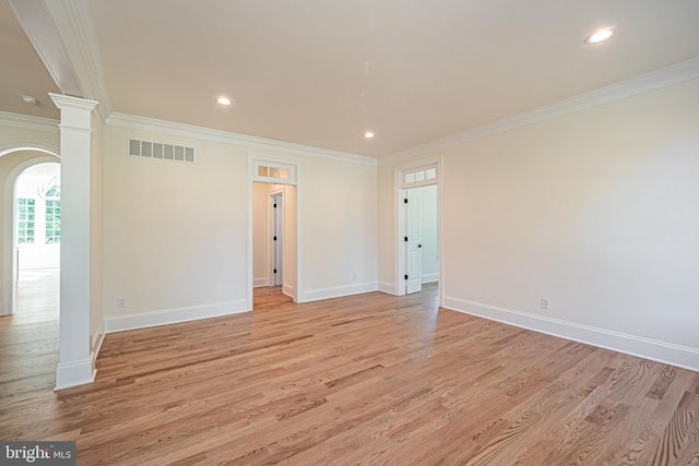 unfurnished room with light hardwood / wood-style floors and crown molding