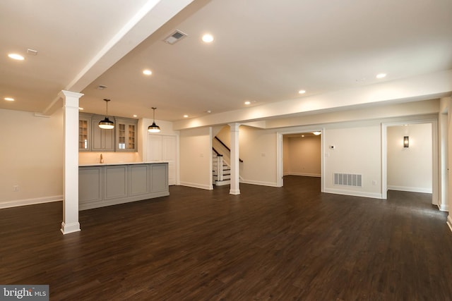 basement featuring dark hardwood / wood-style flooring