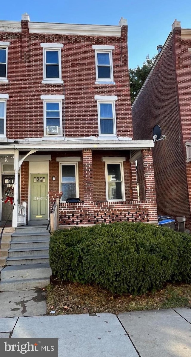 view of property with brick siding