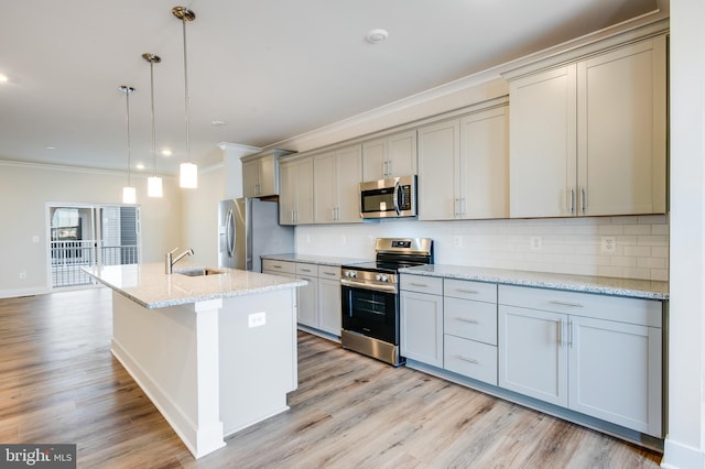 kitchen with decorative backsplash, light stone counters, stainless steel appliances, sink, and pendant lighting