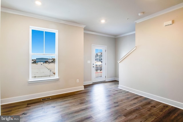 entryway featuring dark hardwood / wood-style floors and crown molding