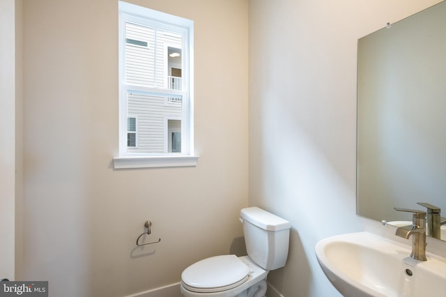 bathroom featuring sink and toilet