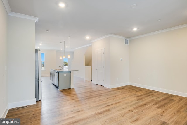 interior space featuring sink, light wood-type flooring, and crown molding