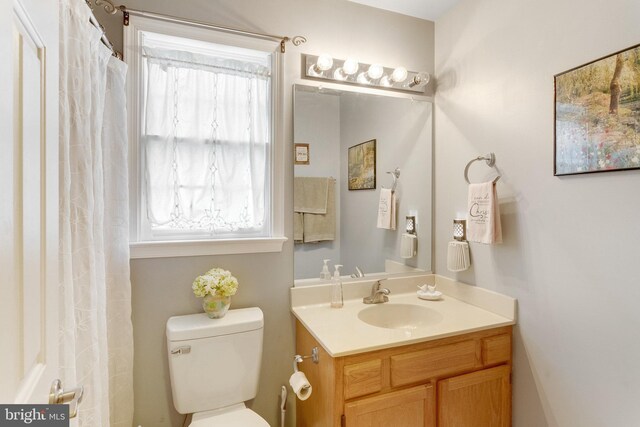 bathroom with vanity and toilet