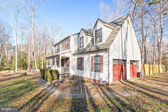 view of front facade featuring a garage and covered porch