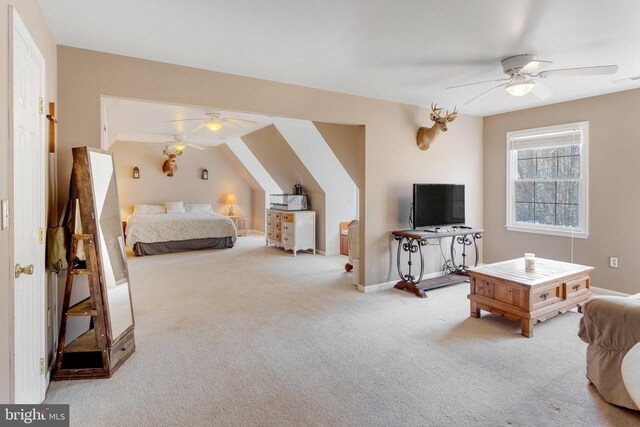 bedroom with carpet flooring, ceiling fan, and lofted ceiling