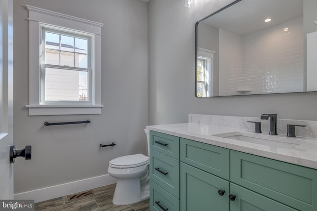 bathroom with vanity and toilet