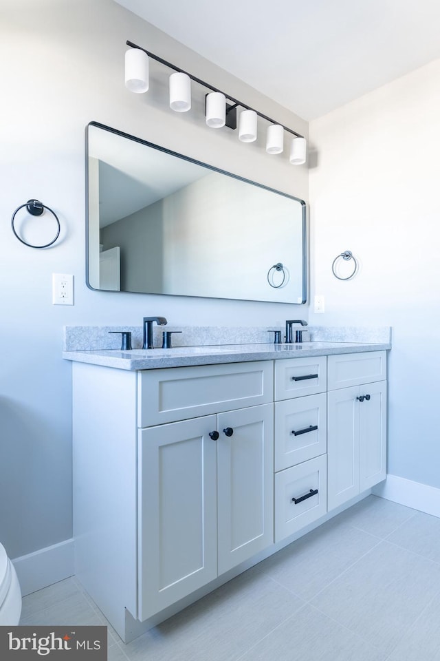 bathroom featuring tile patterned floors and vanity