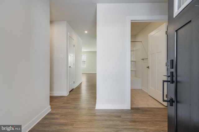 hallway with wood-type flooring