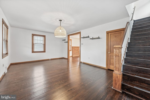 unfurnished room featuring dark hardwood / wood-style flooring