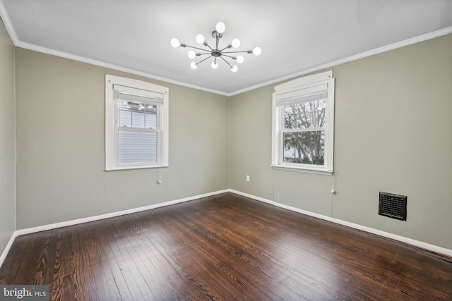 unfurnished room featuring a chandelier, wood-type flooring, and ornamental molding