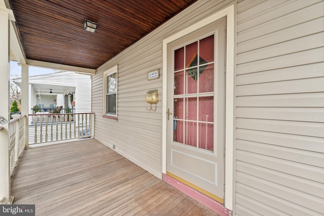 wooden terrace with a porch