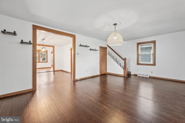 unfurnished room with dark hardwood / wood-style floors