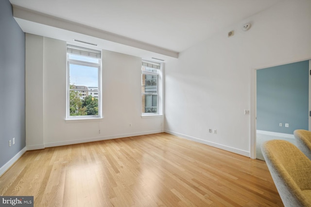 empty room with light hardwood / wood-style floors