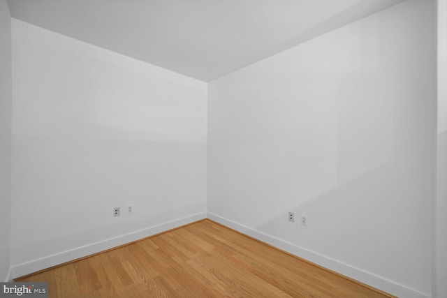 spare room with hardwood / wood-style flooring