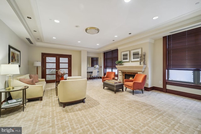 interior space with a fireplace, french doors, light colored carpet, and crown molding