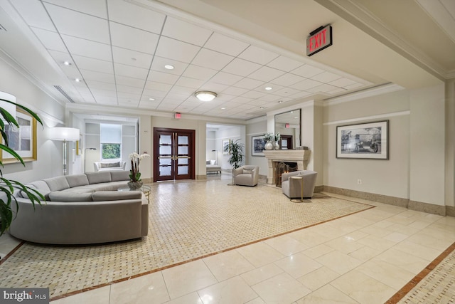 living room featuring french doors, light tile patterned floors, and ornamental molding