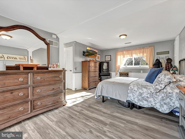 bedroom with light wood-type flooring