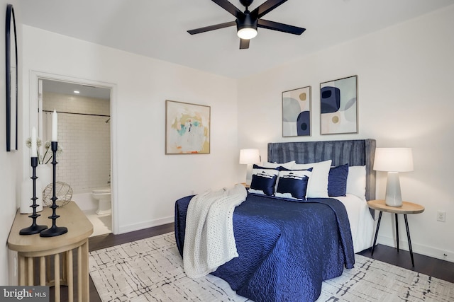 bedroom with hardwood / wood-style flooring, ensuite bath, and ceiling fan