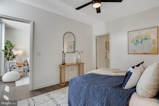 bedroom with ceiling fan and dark hardwood / wood-style floors