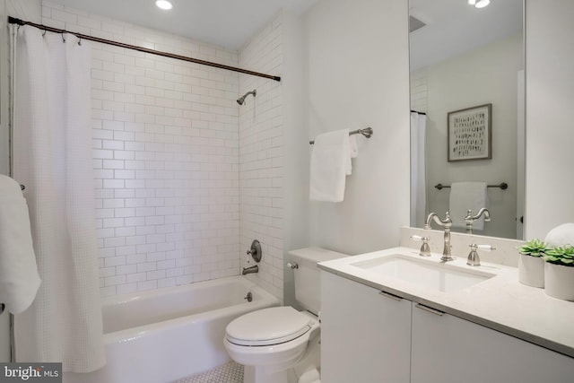 full bathroom with vanity, toilet, and shower / tub combo