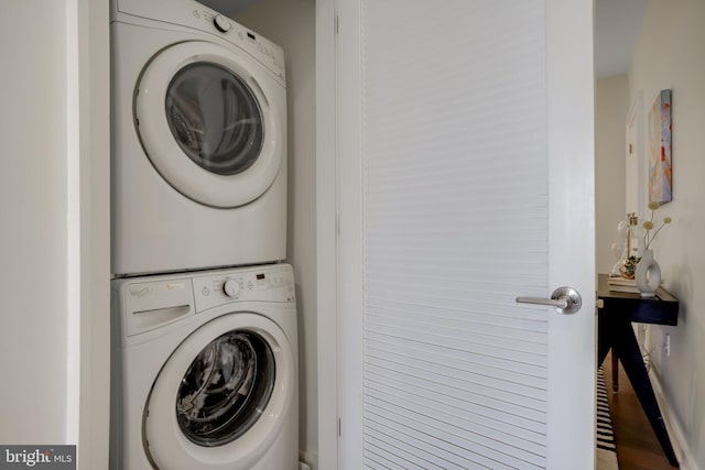 laundry room featuring stacked washer and clothes dryer