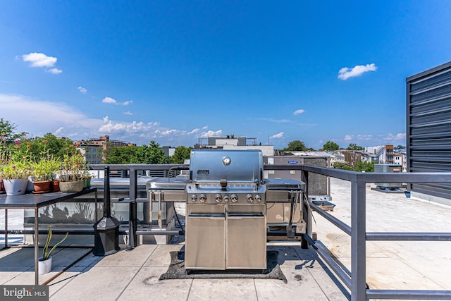 view of patio featuring a balcony and area for grilling