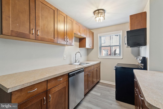 kitchen with stainless steel dishwasher, light hardwood / wood-style floors, black range with electric stovetop, and sink