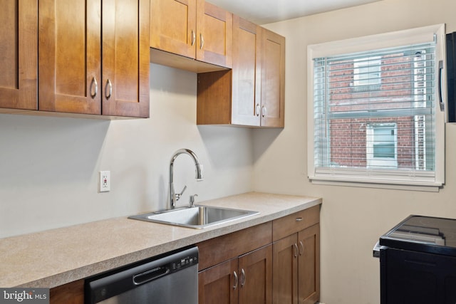 kitchen with dishwasher, range, and sink