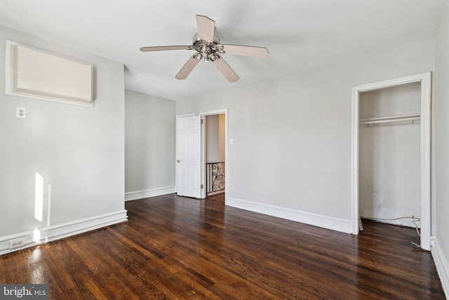 unfurnished bedroom featuring ceiling fan and dark hardwood / wood-style flooring