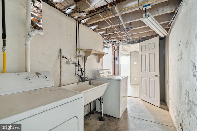 clothes washing area with separate washer and dryer