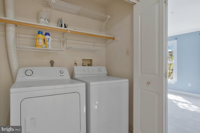 laundry room with carpet flooring and washing machine and dryer