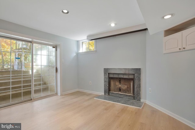 unfurnished living room featuring light hardwood / wood-style floors