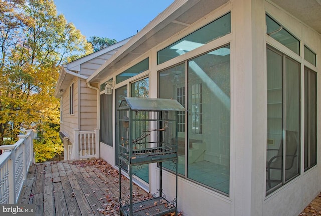 wooden terrace featuring a sunroom