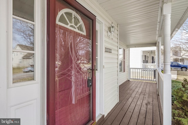 entrance to property featuring a porch