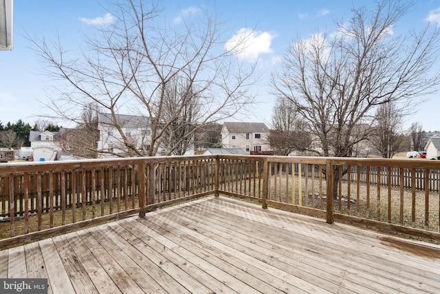 wooden terrace with a residential view