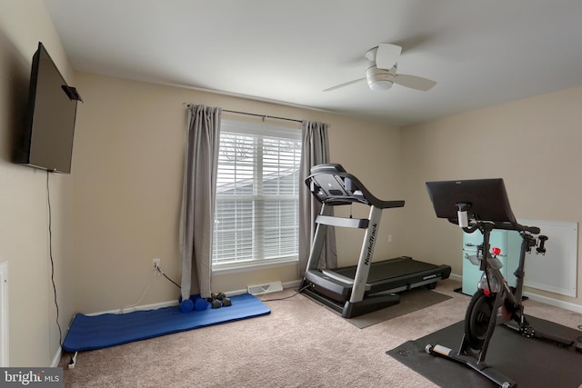 workout area with visible vents, baseboards, ceiling fan, and light colored carpet