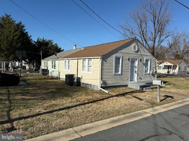 view of property exterior featuring a yard and central air condition unit