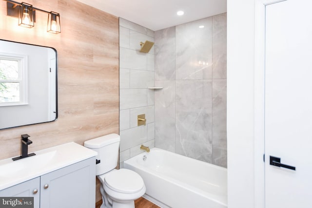 full bathroom featuring shower / tub combination, vanity, and toilet