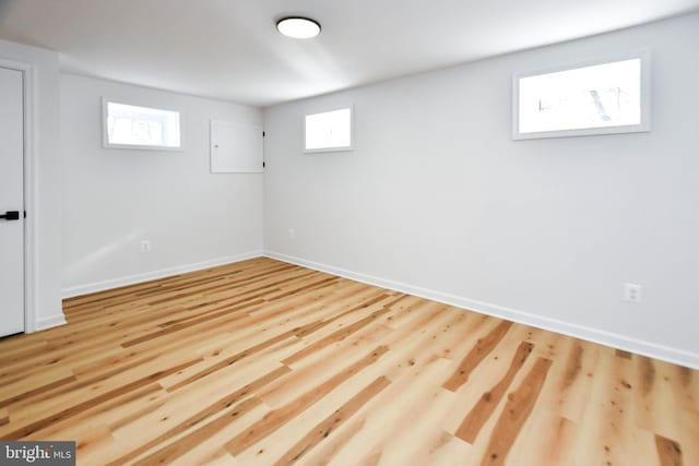 basement featuring light hardwood / wood-style floors