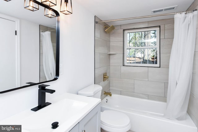 full bathroom with shower / bath combination with curtain, toilet, and vanity