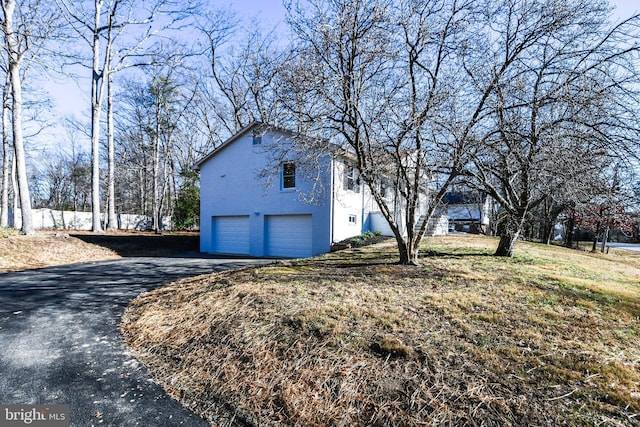 view of home's exterior with a garage