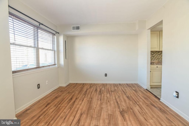 empty room with light wood-type flooring