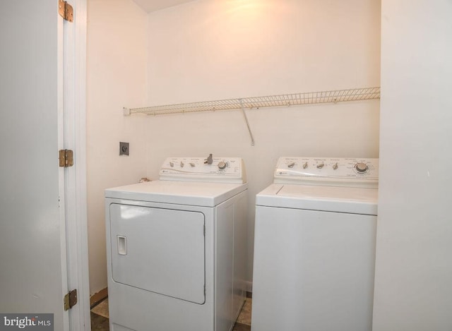 laundry area with independent washer and dryer