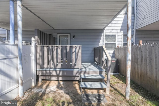 view of patio / terrace with a wooden deck and cooling unit