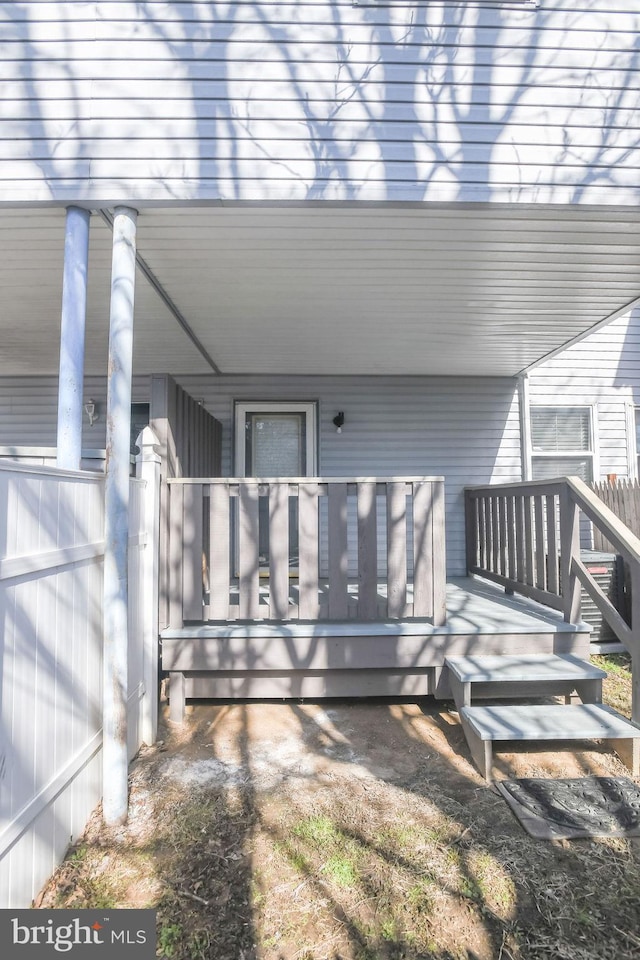 doorway to property with a wooden deck